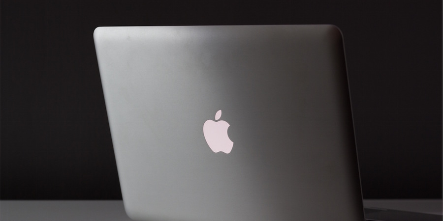 Back side of open Apple laptop.
