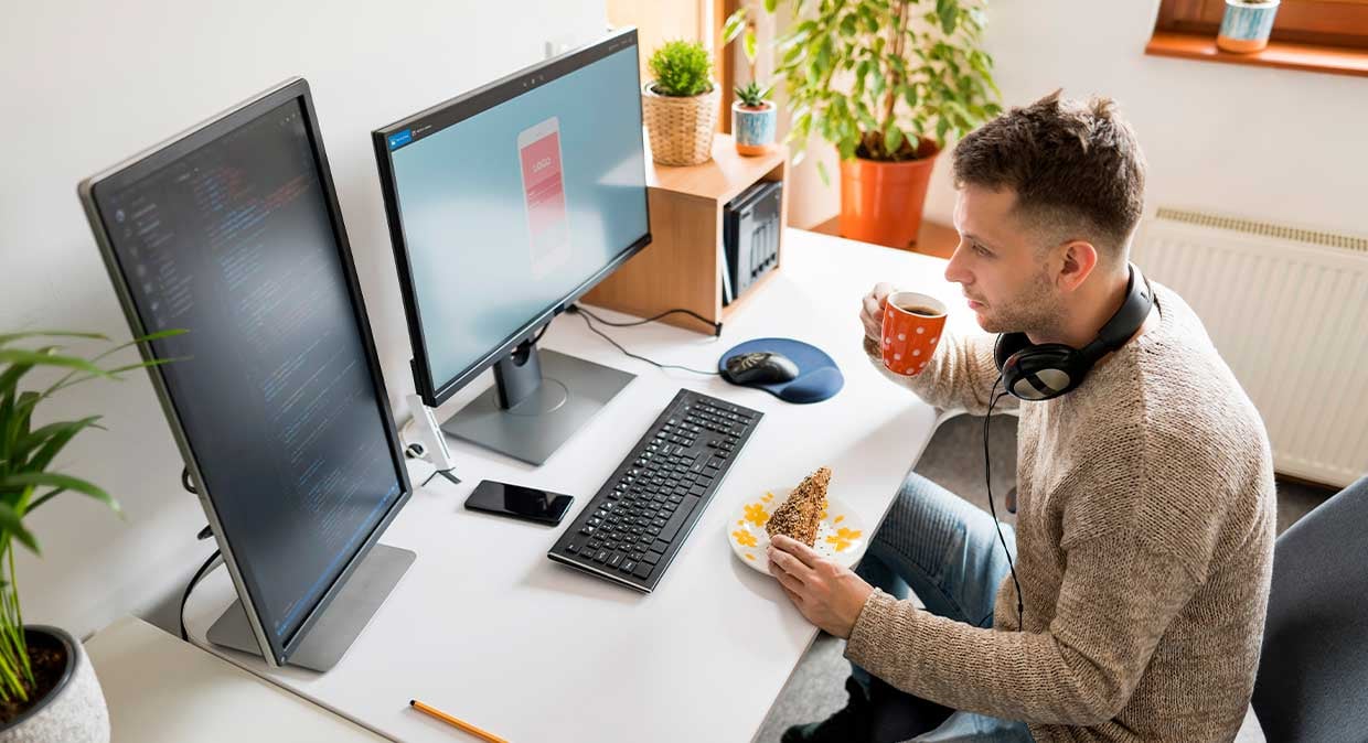 web_developer_at_desk_with_coffee