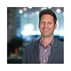 Mark Roberge headshot. He is wearing a button down shirt and suit jacket