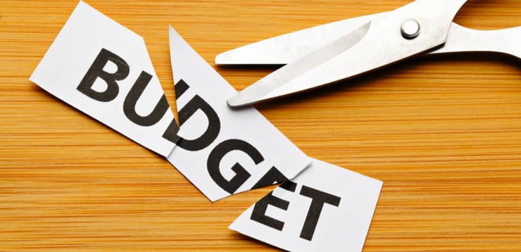 Marketing budget cuts with scissors