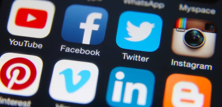 Social media app icons on a phone