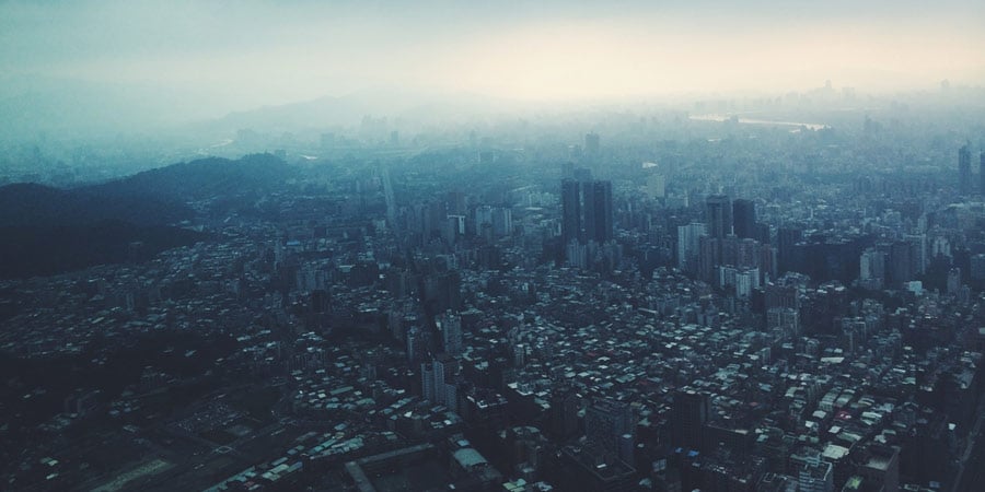 Large metropolitan area with smaller buildings and sky scrapers.