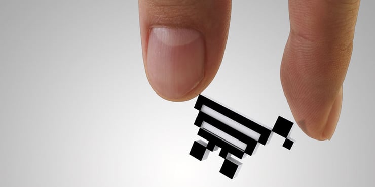 Two fingers holding a shopping cart icon.