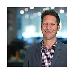 Mark Roberge headshot. He is wearing a button down shirt and suit jacket