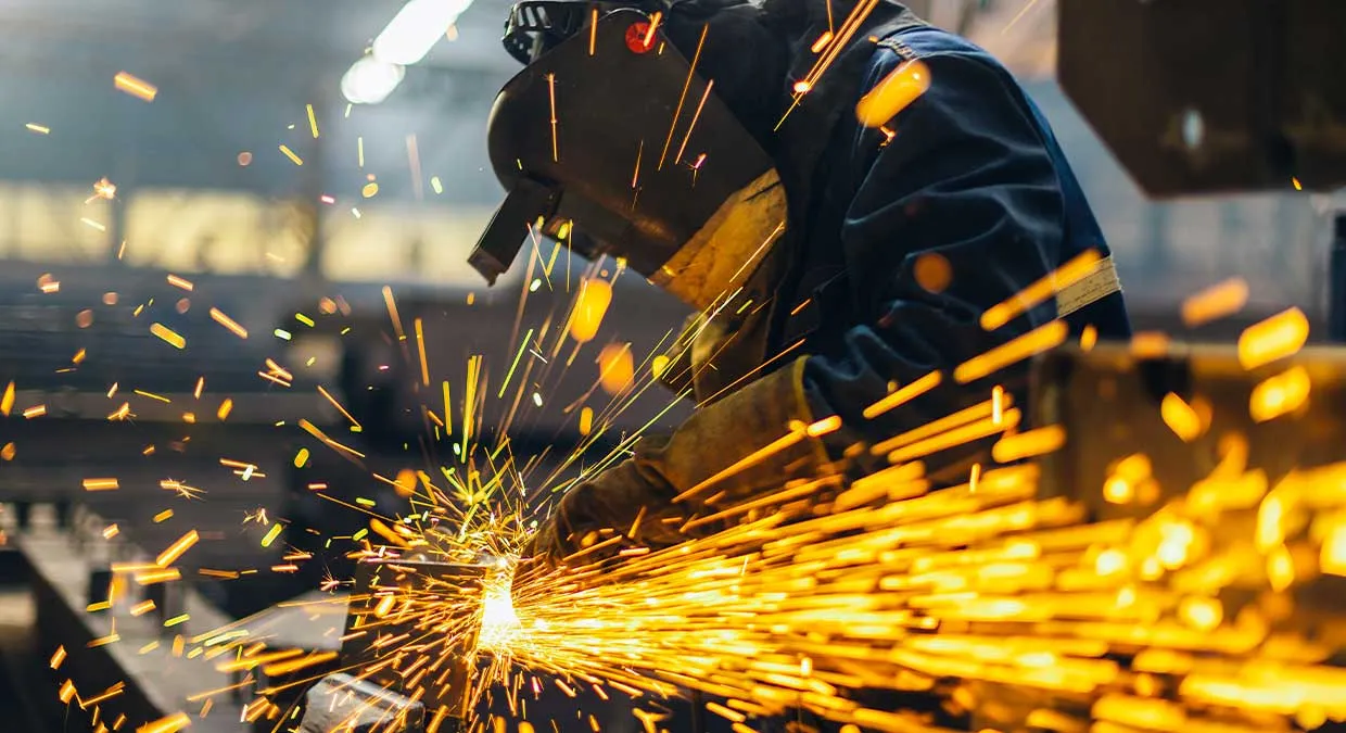 production_worker_grinding_steel