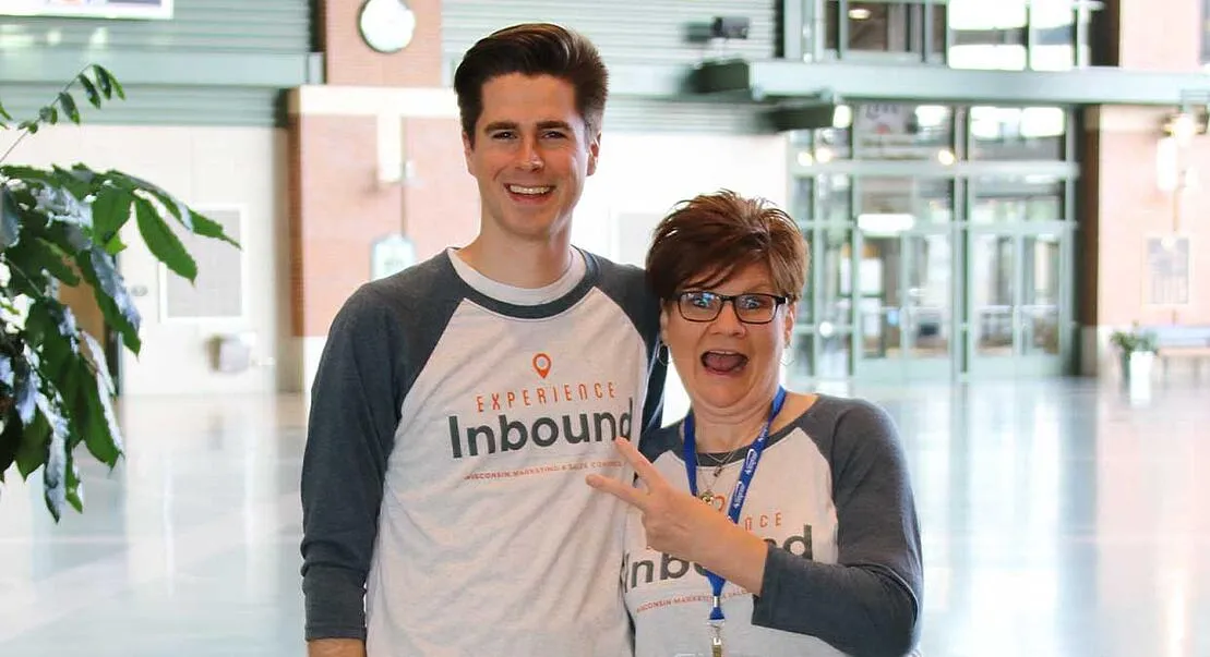 Two Weidert Group employees in Experience Inbound shirts